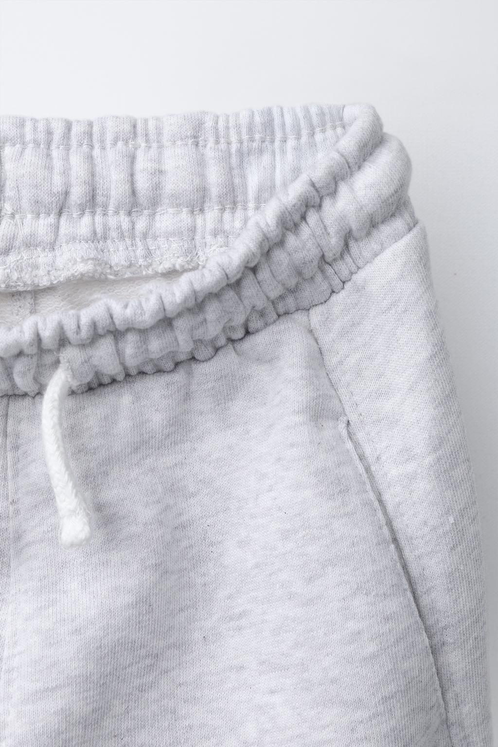 БРЮКИ-ДЖОГГЕРЫ С ЭТИКЕТКОЙ