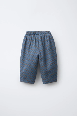 Брюки бэгги с цветочным принтом- Заказать в России