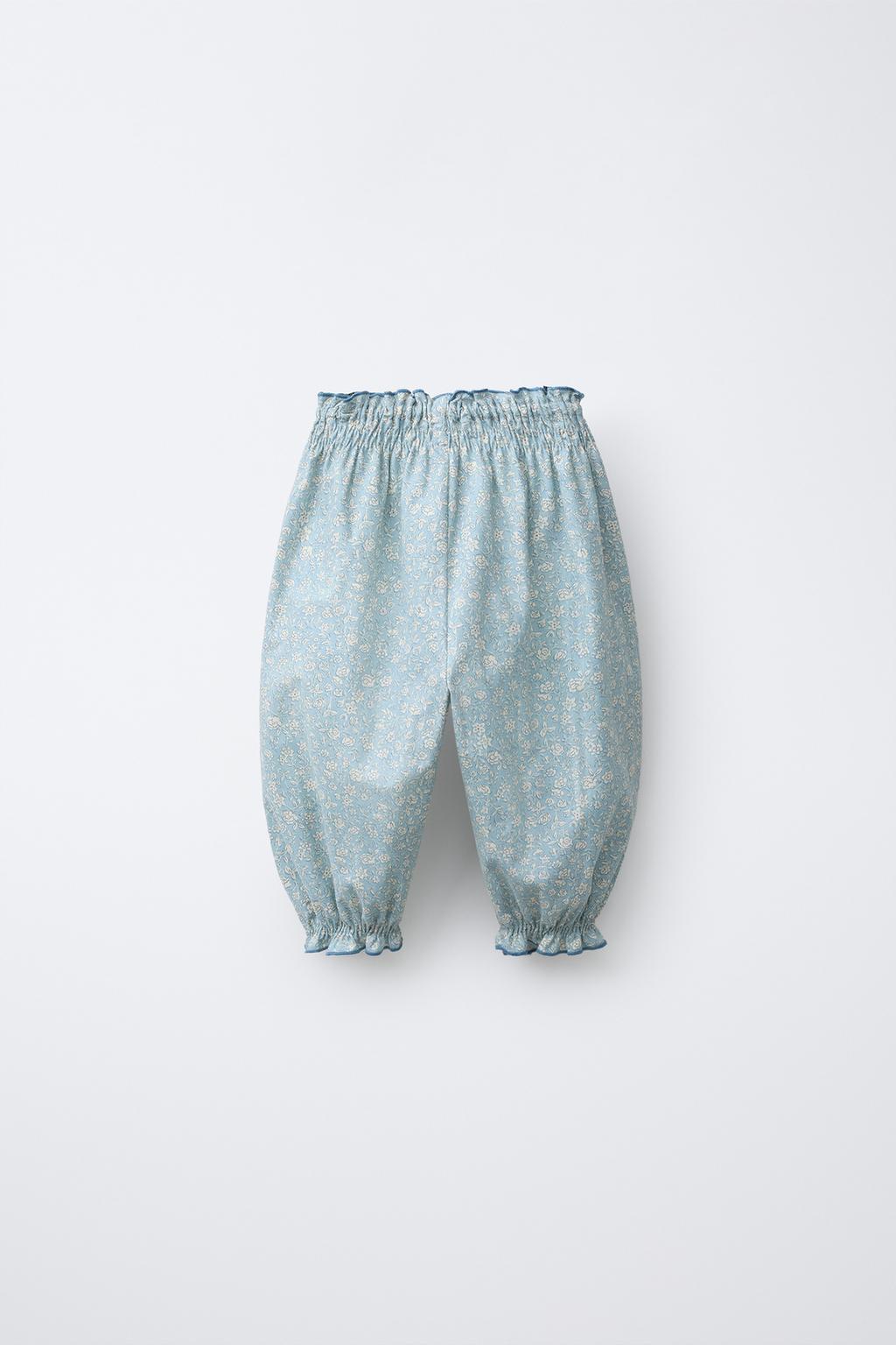 БРЮКИ С ЦВЕТОЧНЫМ ПРИНТОМ