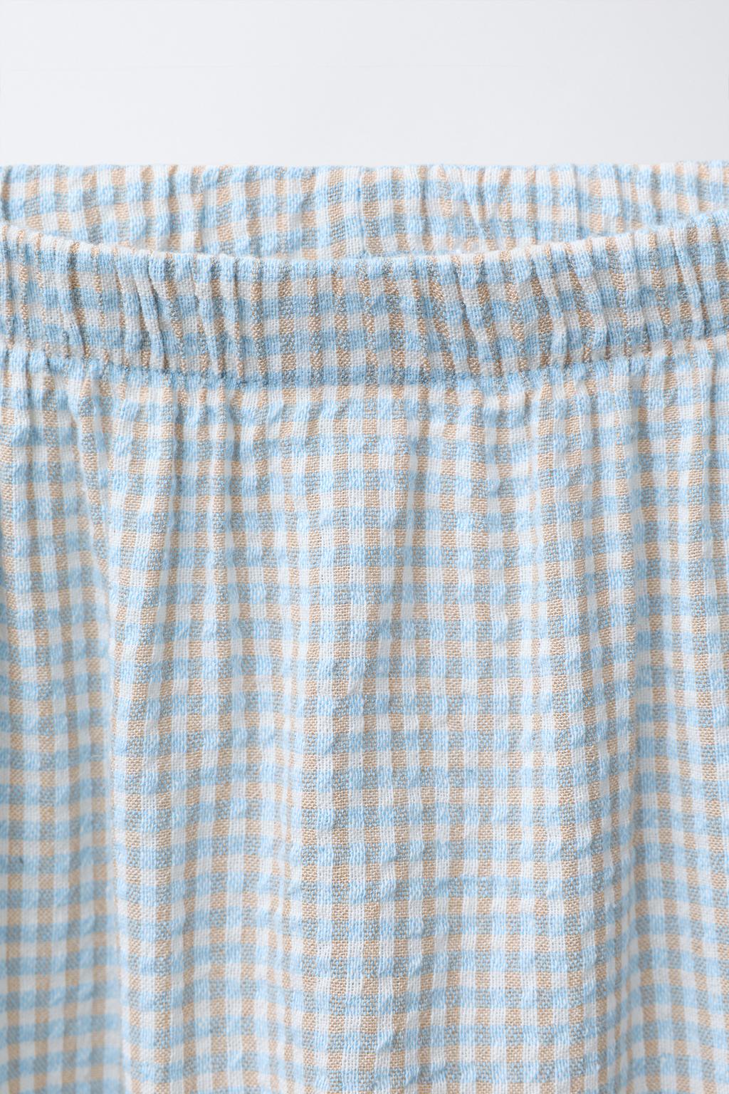 БРЮКИ ИЗ РЕЛЬЕФНОЙ ТКАНИ В КЛЕТКУ