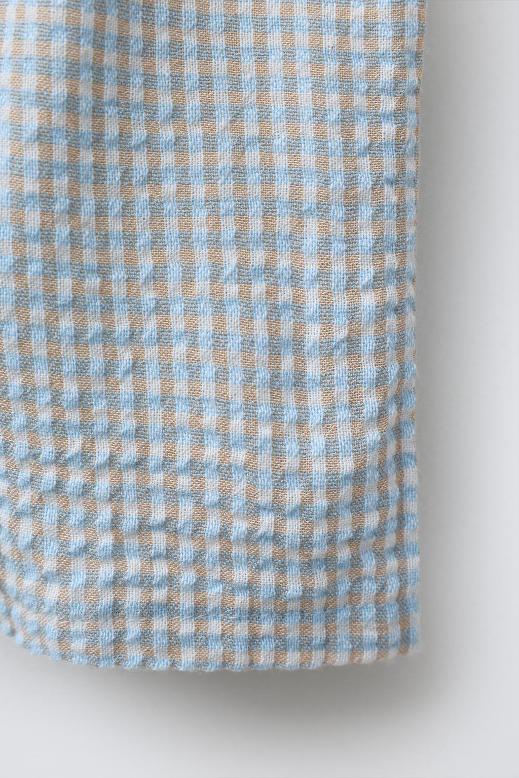 БРЮКИ ИЗ РЕЛЬЕФНОЙ ТКАНИ В КЛЕТКУ