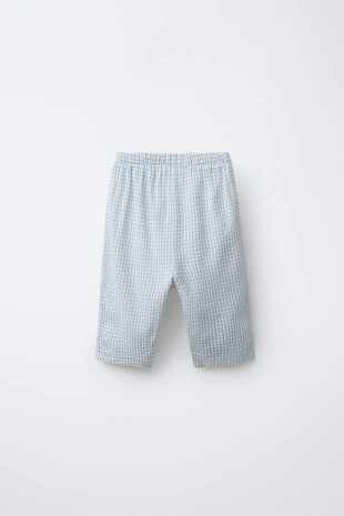 Брюки из рельефной ткани в клетку- Заказать в России