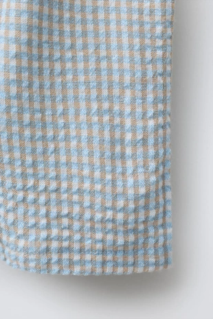 Брюки из рельефной ткани в клетку- Заказать в России