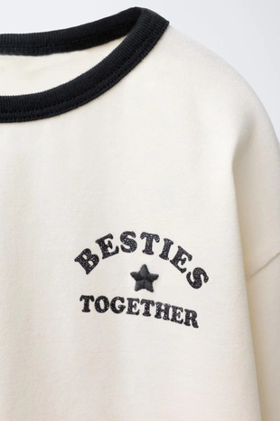 Лонгслив с блестящим принтом- Заказать в России