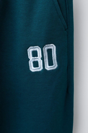 Джоггеры из мягкой ткани с номером- Заказать в России