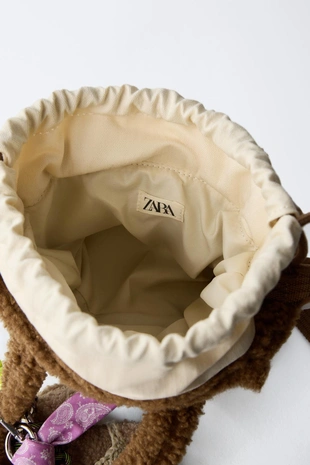 Сумка через плечо с искусственным мехом и подвесками- Заказать в России