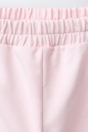 Брюки с защипами и сердечками