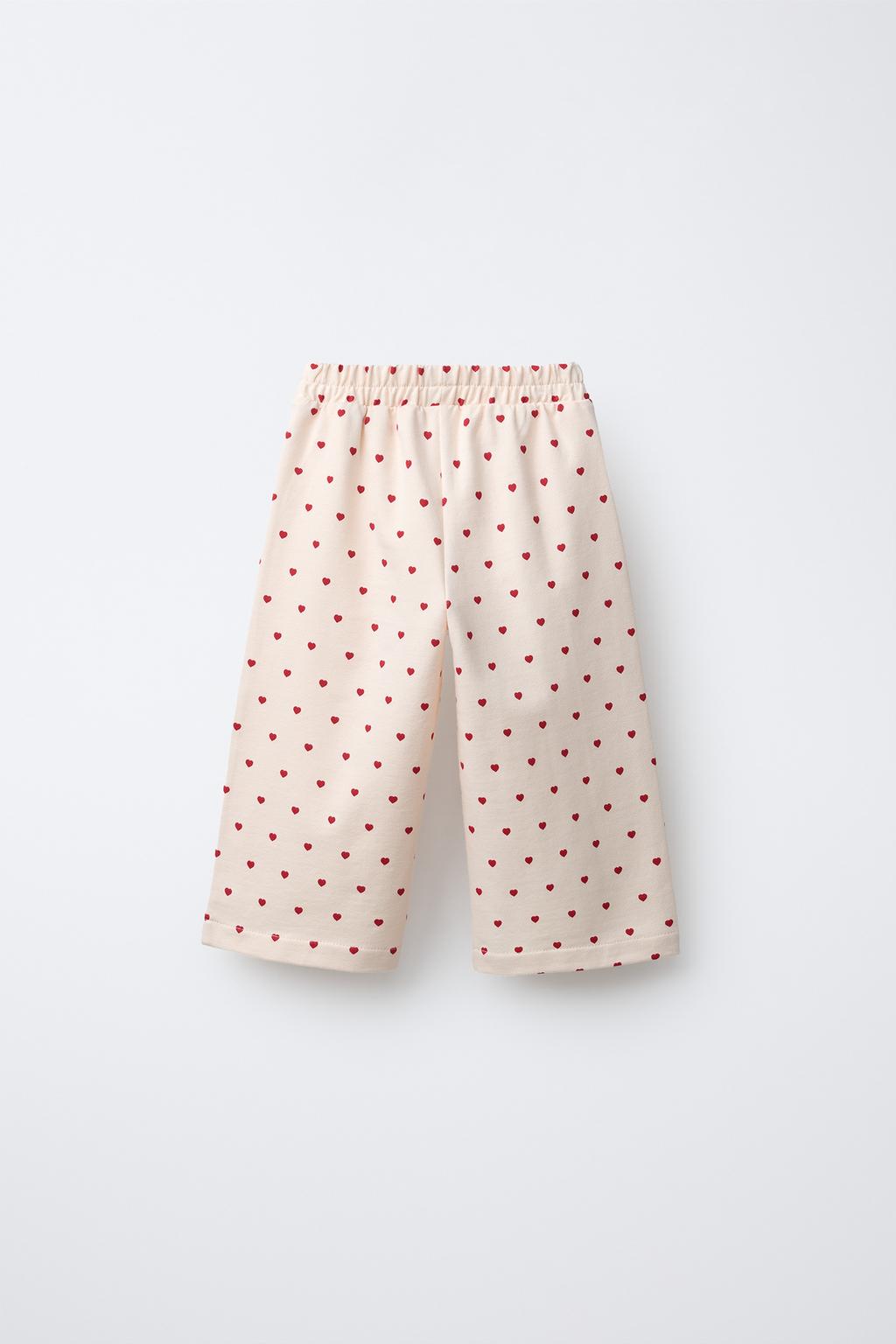 БРЮКИ С ЗАЩИПАМИ И СЕРДЕЧКАМИ