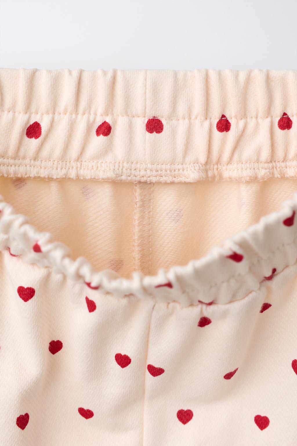 БРЮКИ С ЗАЩИПАМИ И СЕРДЕЧКАМИ