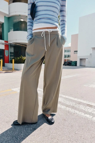 Брюки с широкими штанинами и двойным поясом- Заказать в России