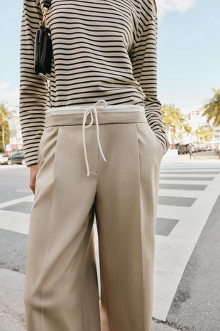 Брюки с широкими штанинами и двойным поясом- Заказать в России