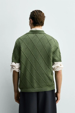 Поло с текстурным узором и прозрачной вязкой- Заказать в России