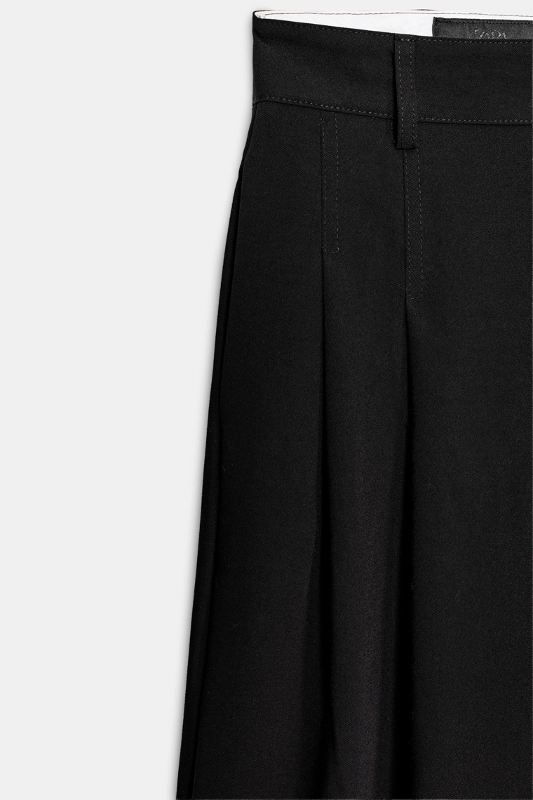 Брюки со складками