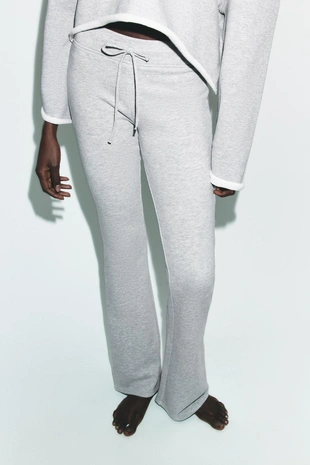 Расклешенные брюки с эффектом потертости- Заказать в России