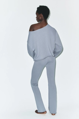 Расклешенные брюки с эффектом потертости- Заказать в России