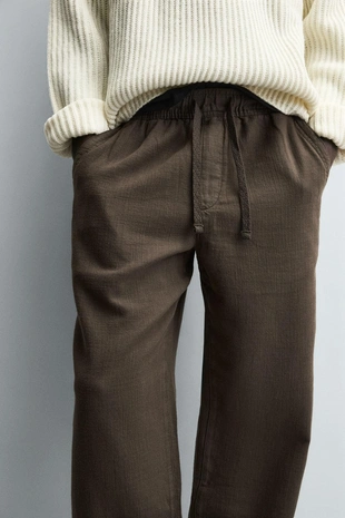 Текстурированные брюки свободного кроя- Заказать в России