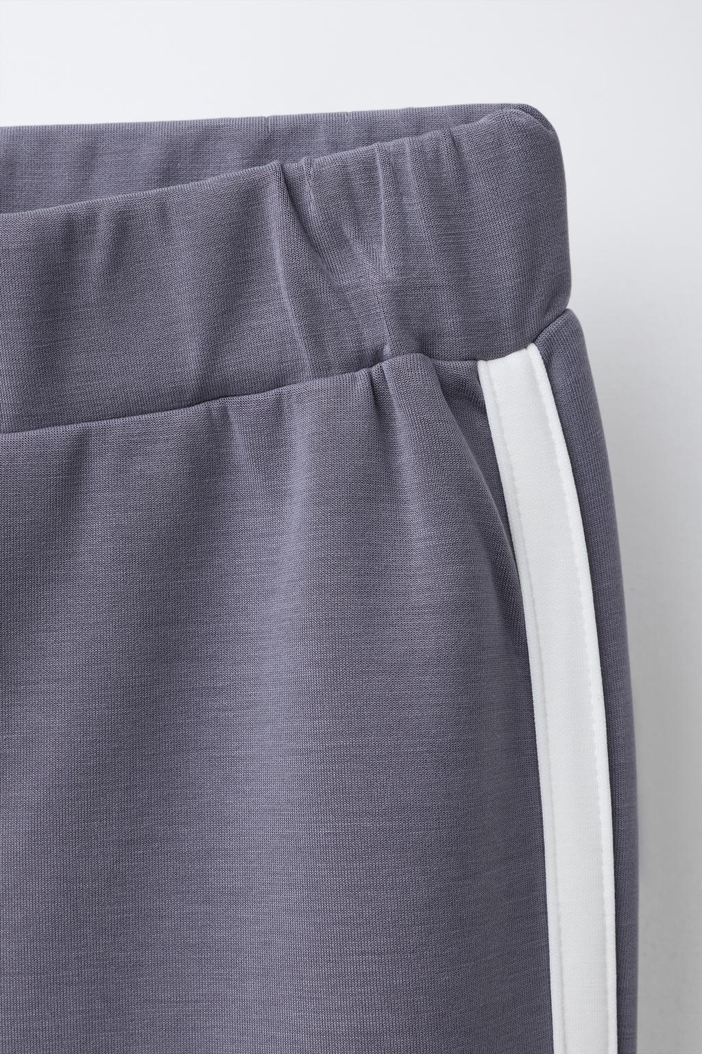 РАСКЛЕШЕННЫЕ БРЮКИ ИЗ МОДАЛА С КОНТРАСТНЫМИ ПОЛОСКАМИ