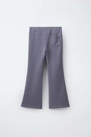 Расклешенные брюки из модала с контрастными полосками- Заказать в России