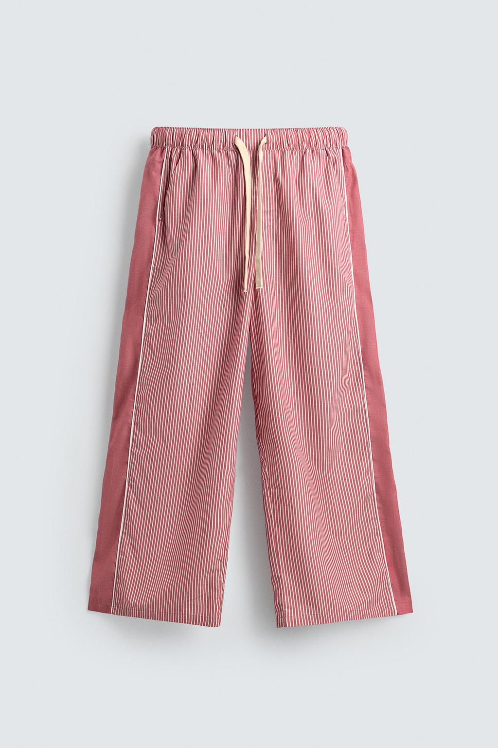 БРЮКИ В ПОЛОСКУ С КОНТРАСТНЫМИ ЛАМПАСАМИ