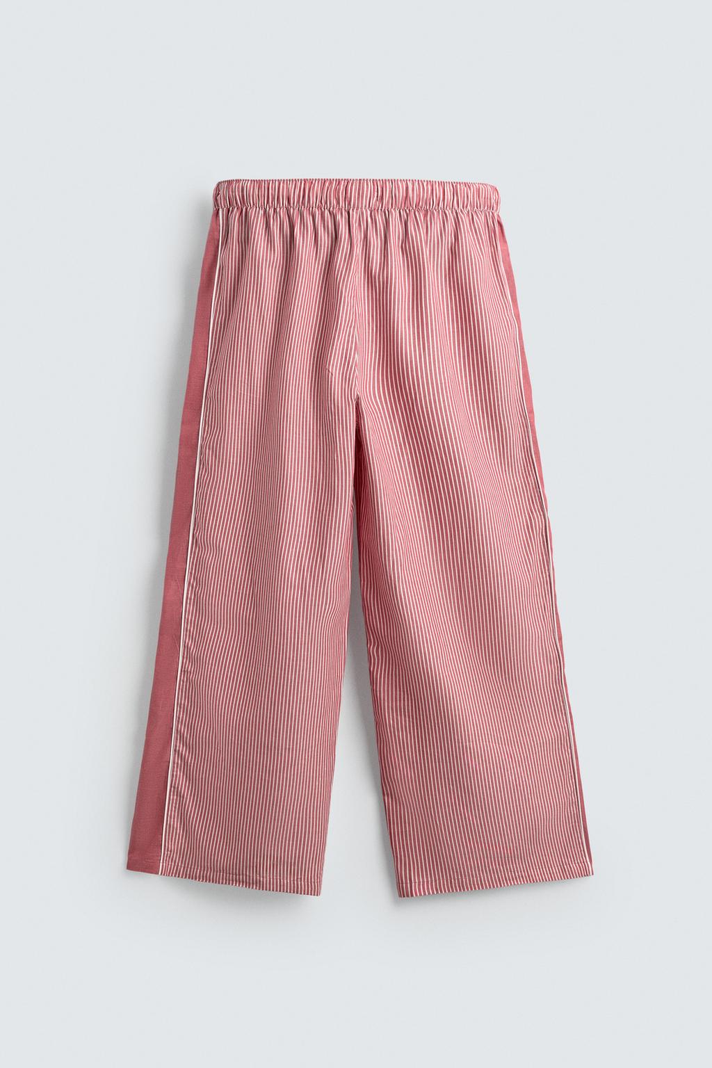 БРЮКИ В ПОЛОСКУ С КОНТРАСТНЫМИ ЛАМПАСАМИ