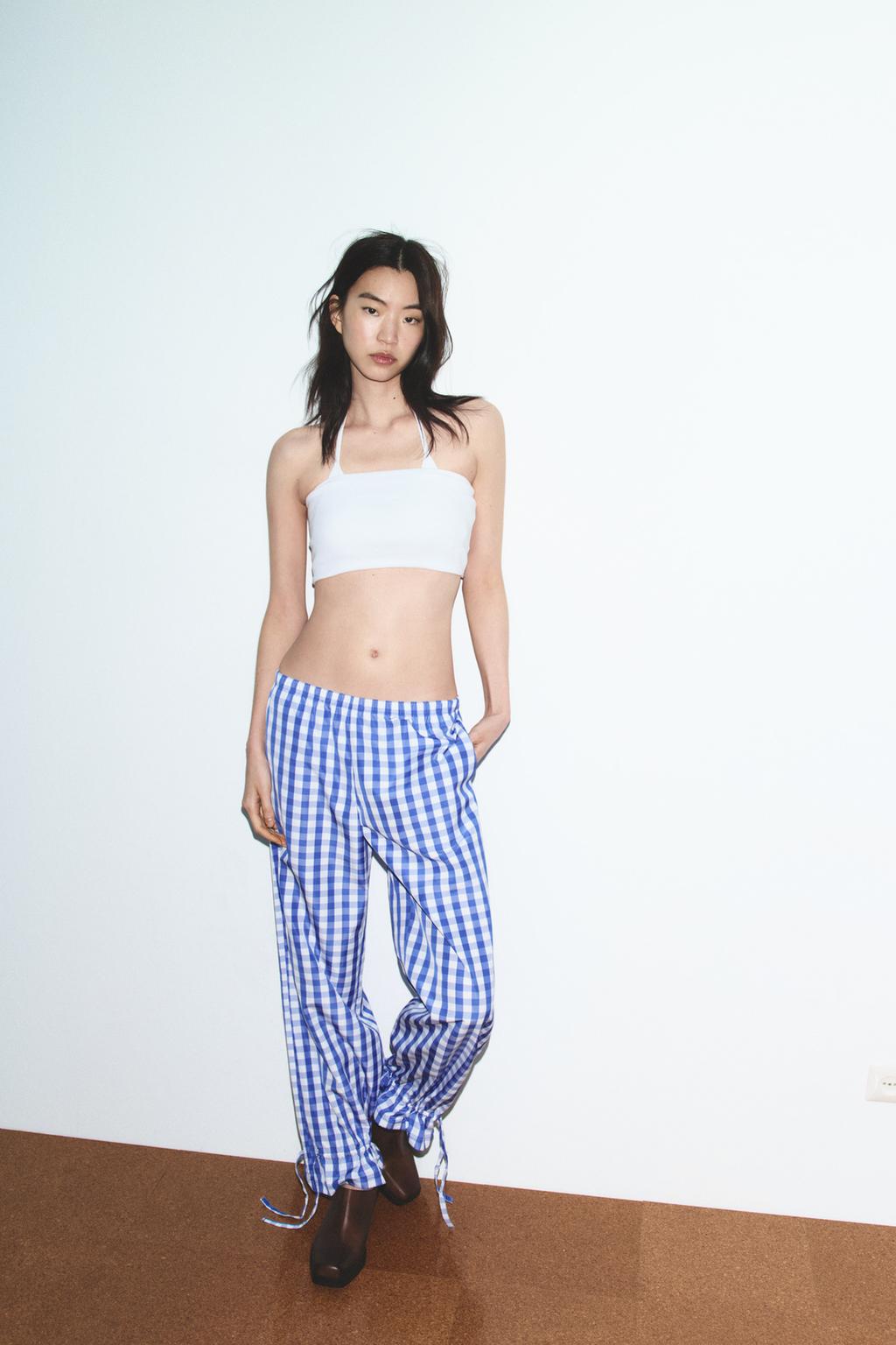 БРЮКИ В КЛЕТКУ ВИШИ ИЗ НЕЙЛОНА