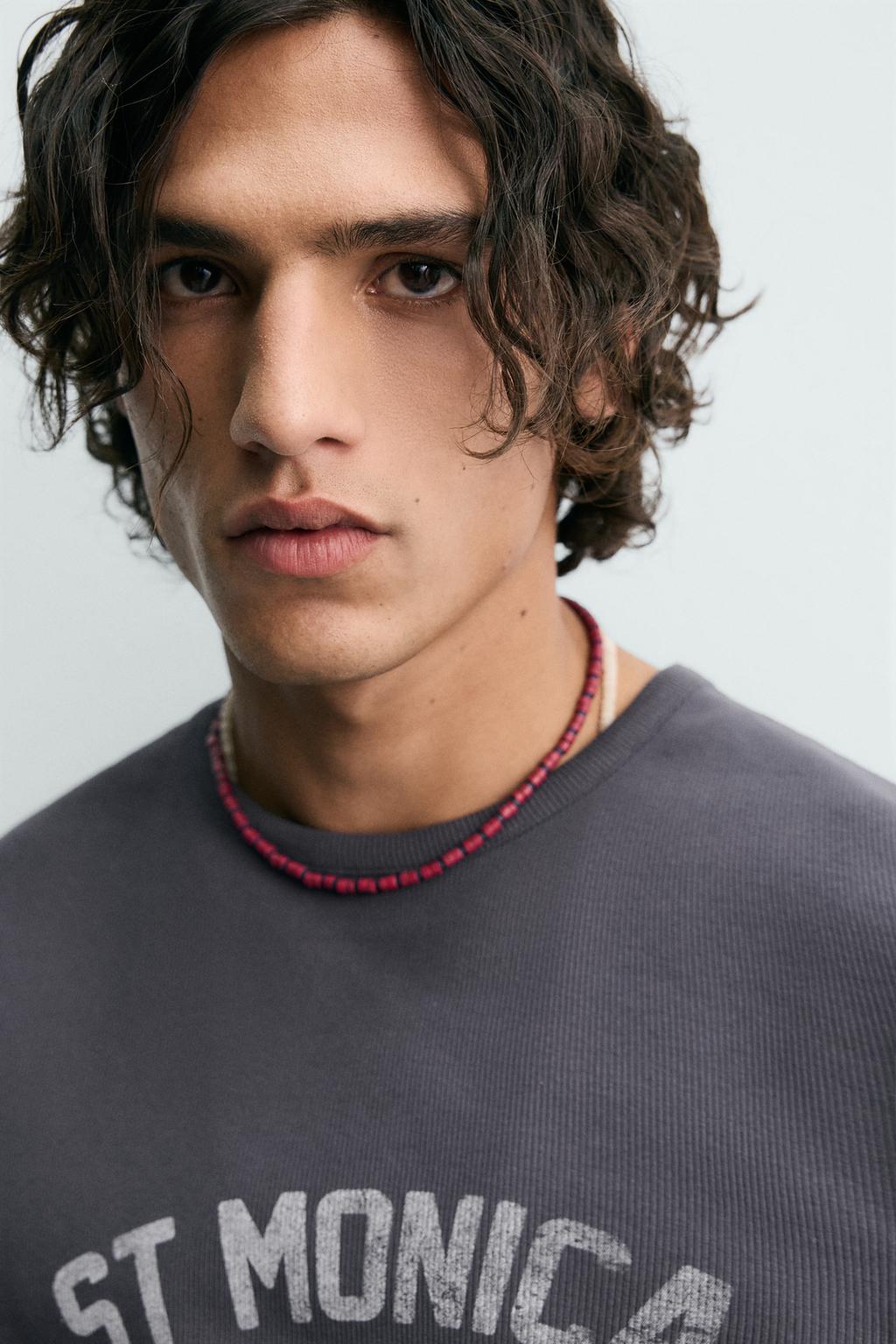 ФУТБОЛКА В РУБЧИК С ПРИНТАМИ И ЭФФЕКТОМ ПОТЕРТОСТИ