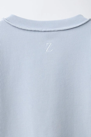 Футболка оверлок с пуговицами- Заказать в России