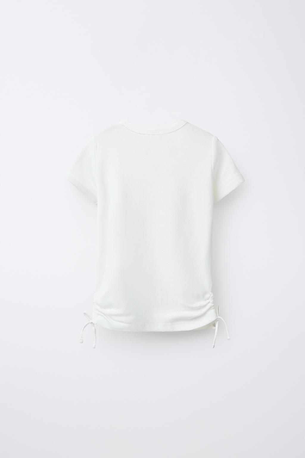 ФУТБОЛКА ИЗ МОДАЛА С ВЫРЕЗАМИ И БАНТАМИ