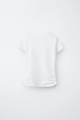 Футболка из модала с вырезами и бантами