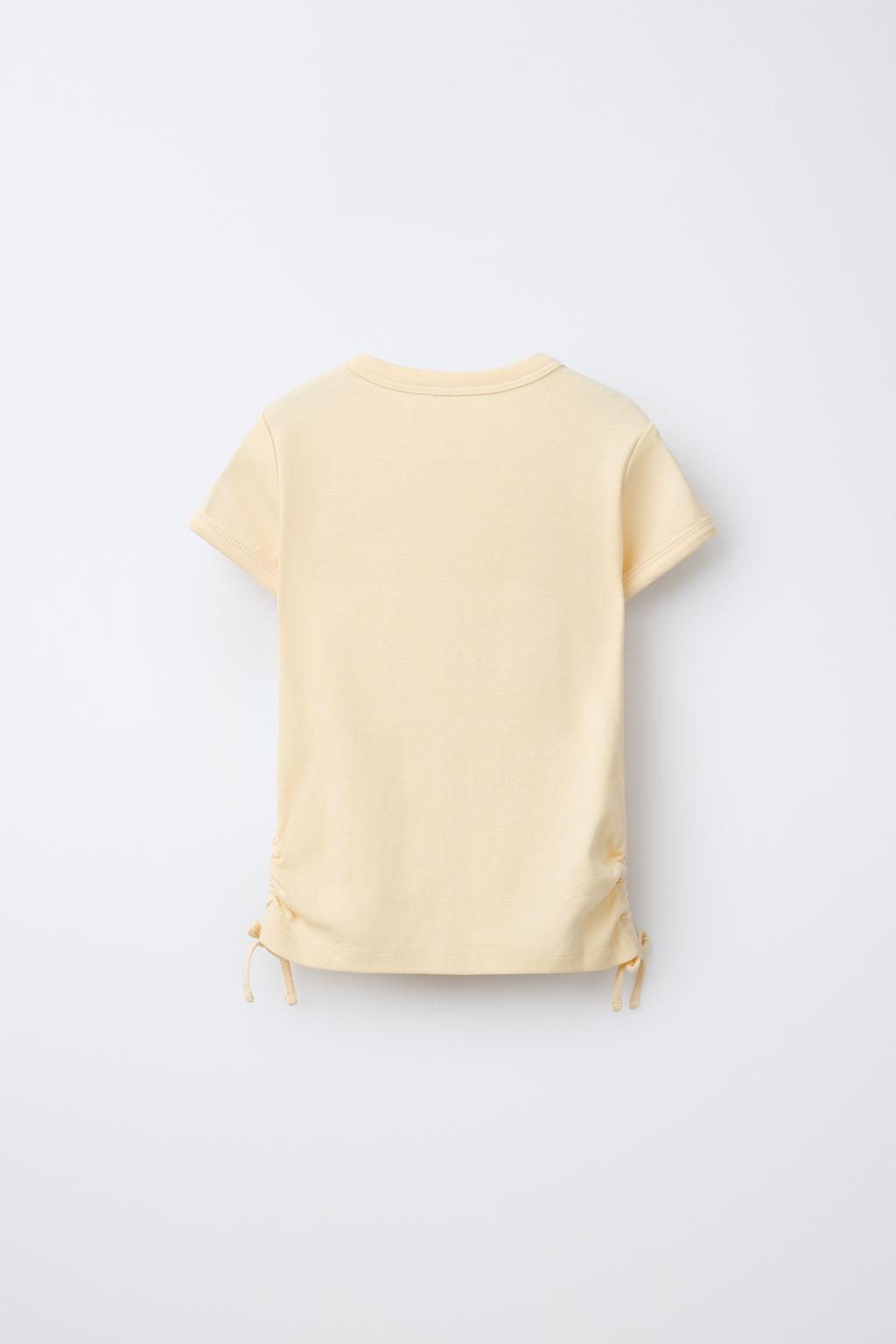 ФУТБОЛКА ИЗ МОДАЛА С ВЫРЕЗАМИ И БАНТАМИ