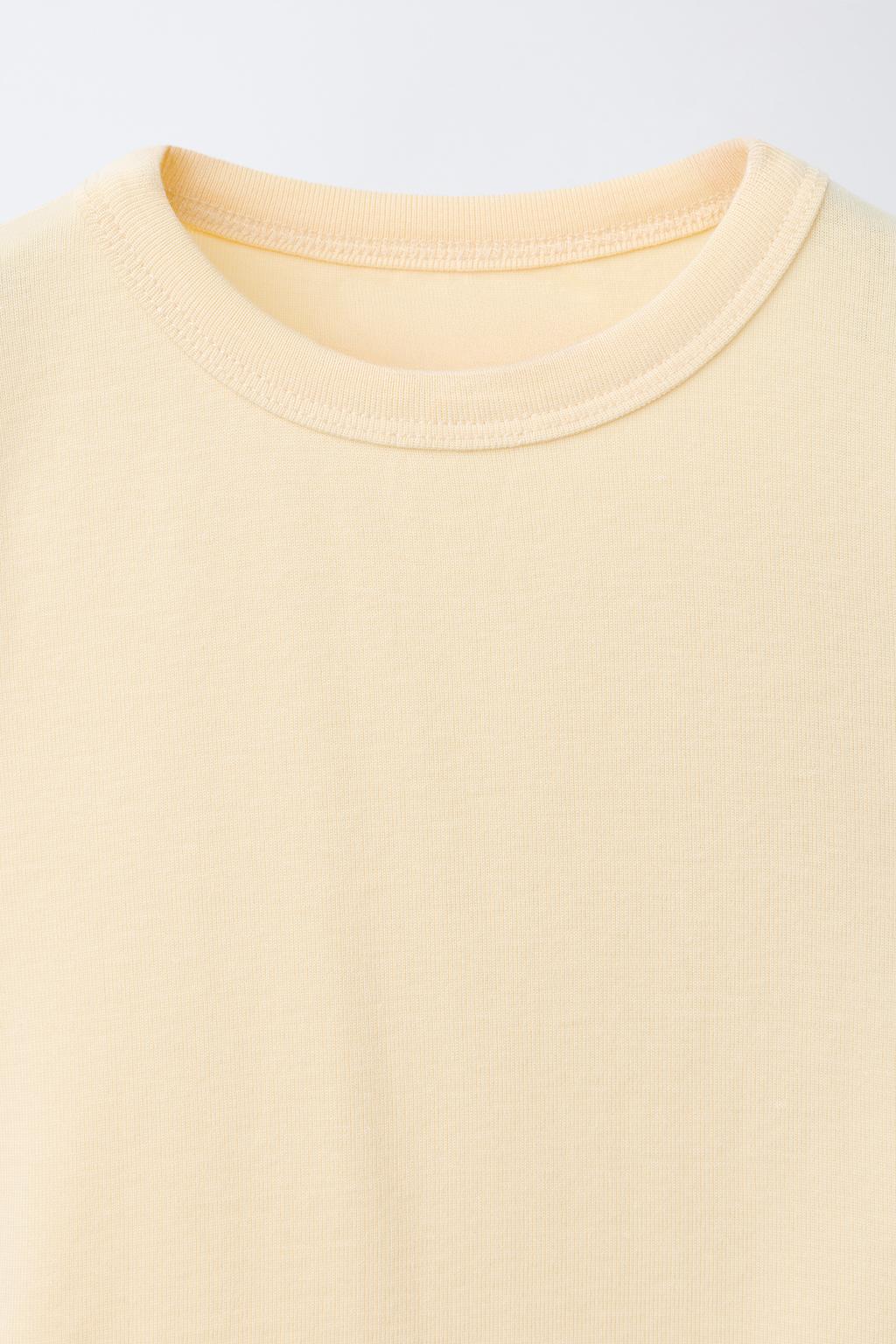 ФУТБОЛКА ИЗ МОДАЛА С ВЫРЕЗАМИ И БАНТАМИ