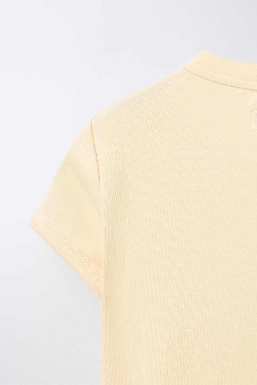 ФУТБОЛКА ИЗ МОДАЛА С ВЫРЕЗАМИ И БАНТАМИ