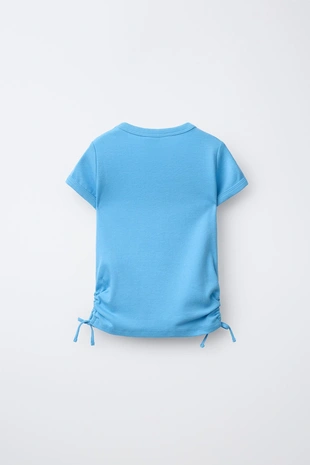 Футболка из модала с вырезами и бантами