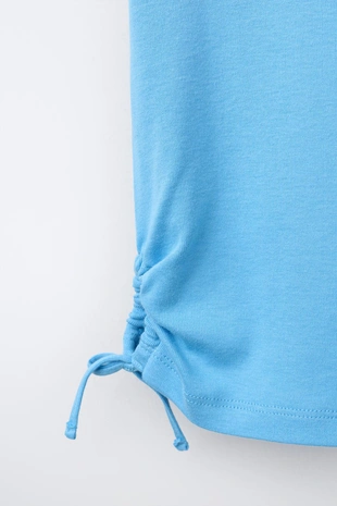 Футболка из модала с вырезами и бантами