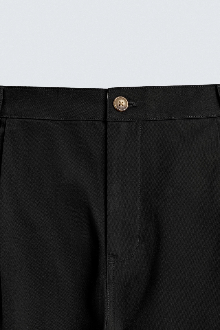 Широкие брюки с защипами