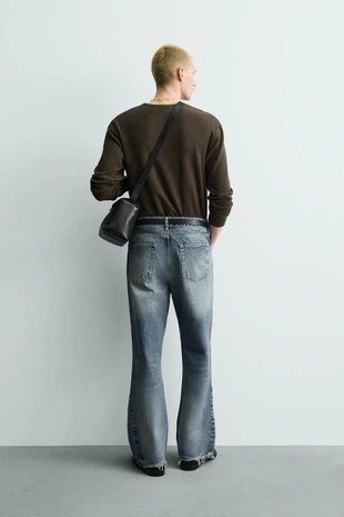 Расклешенные джинсы с разрезами- Заказать в России