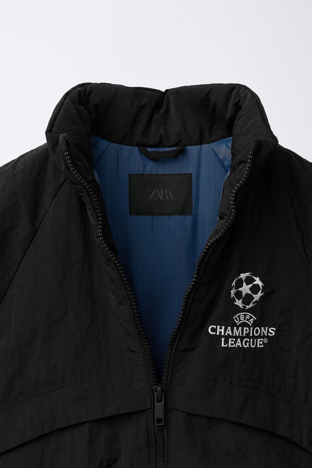 КУРТКА С ПОТАЙНЫМ КАПЮШОНОМ WATER REPELLENT UEFA CHAMPIONS LEAGUE ®