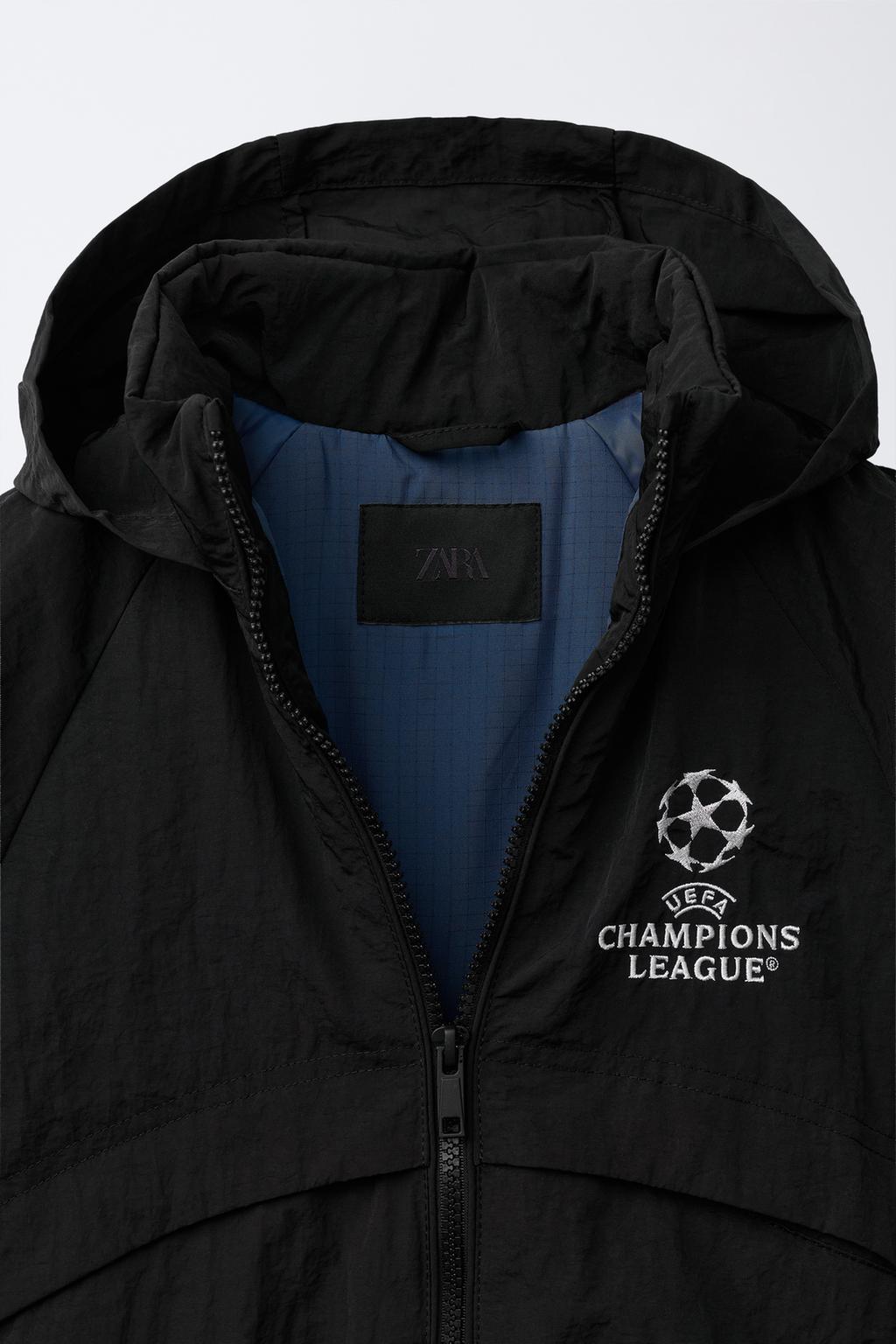 КУРТКА С ПОТАЙНЫМ КАПЮШОНОМ WATER REPELLENT UEFA CHAMPIONS LEAGUE ®