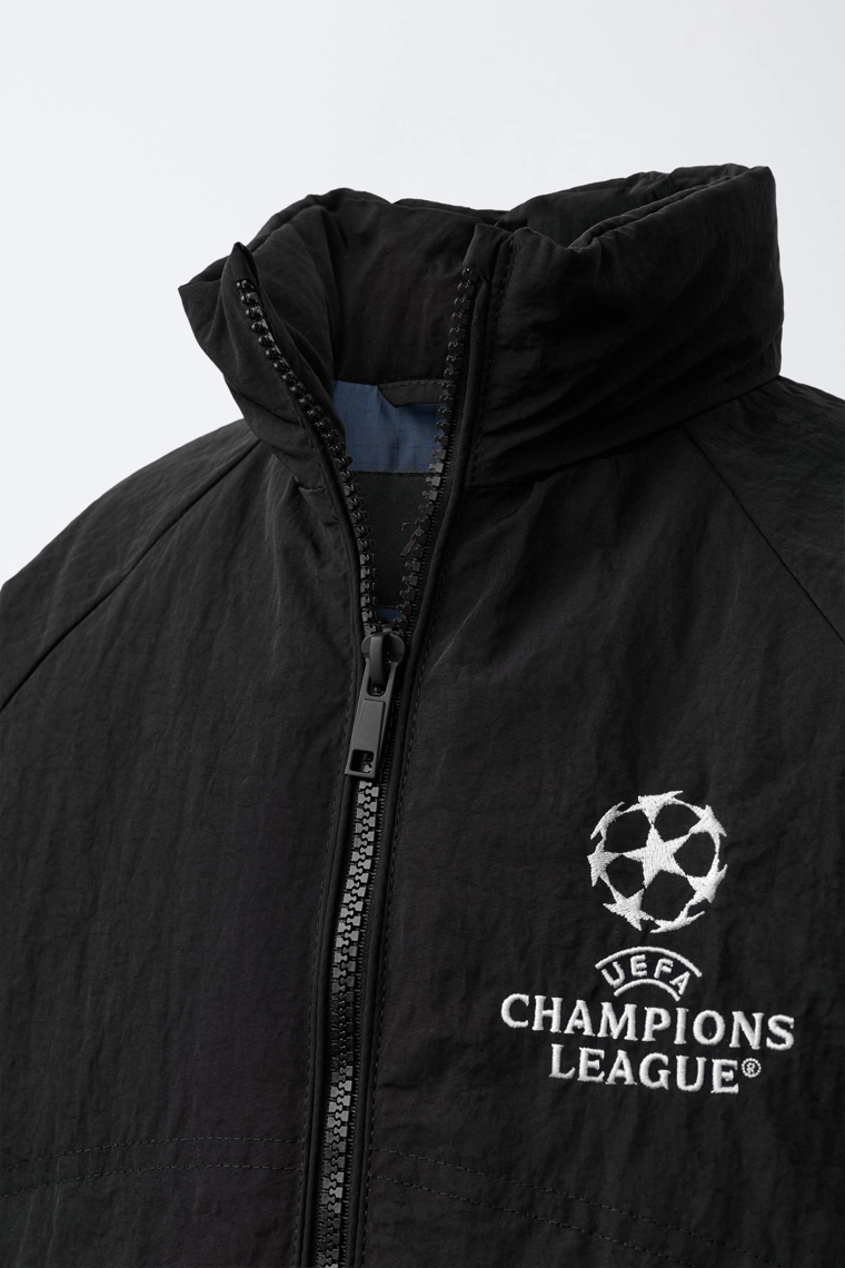 Ветровка с водоотталкивающим покрытием и скрытой капюшоном uefa champions league ®
