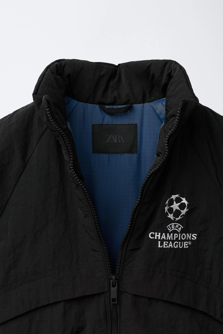 Ветровка с водоотталкивающим покрытием и скрытой капюшоном uefa champions league ®