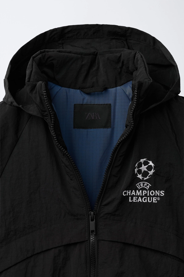 Ветровка с водоотталкивающим покрытием и скрытой капюшоном uefa champions league ®
