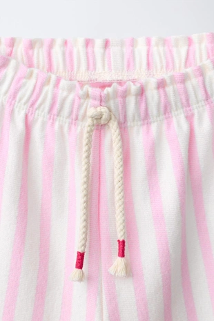 Брюки в полоску с воланами- Заказать в России