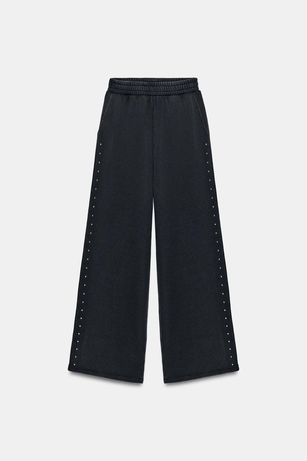 БРЮКИ ИЗ МЯГКОЙ ТКАНИ С ЭФФЕКТОМ ПОТЕРТОСТИ И ЗАКЛЕПКАМИ