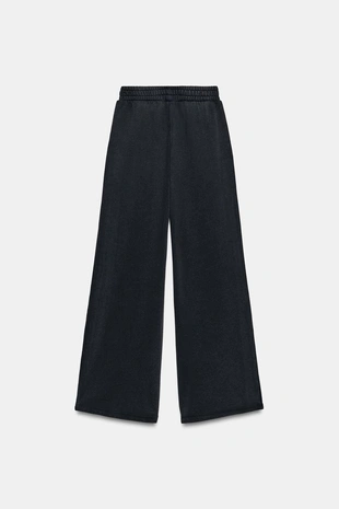 Брюки из мягкой ткани с эффектом потертости и заклепками