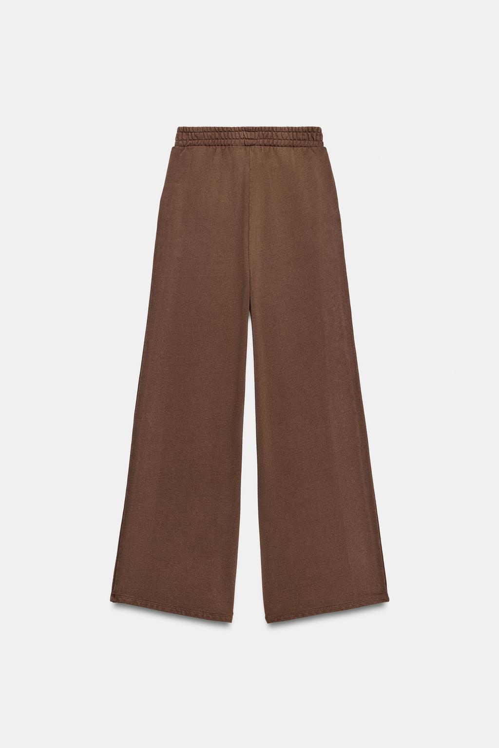 БРЮКИ ИЗ МЯГКОЙ ТКАНИ С ЭФФЕКТОМ ПОТЕРТОСТИ И ЗАКЛЕПКАМИ