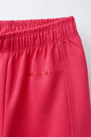 Брюки WIDE LEG из ткани интерлок с рельефной надписью- Заказать в России