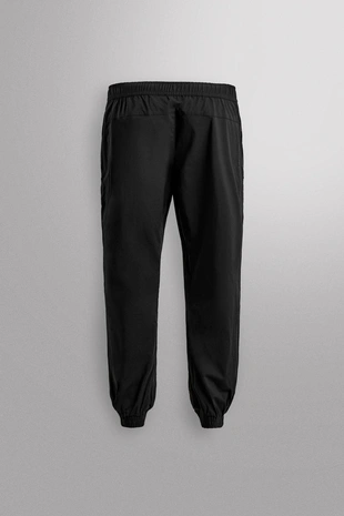 Брюки-джоггеры из высокотехнологичной ткани- Заказать в России