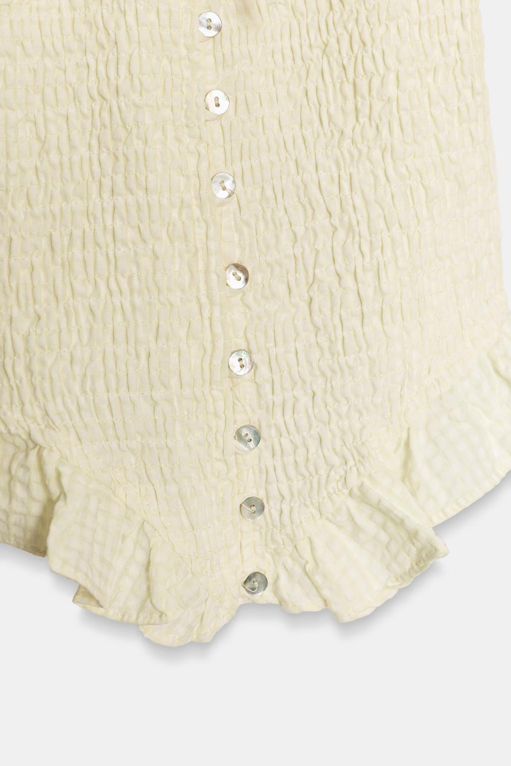 ТОП ИЗ РЕЛЬЕФНОЙ ТКАНИ С БАНТОМ