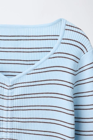 Свитер в рубчик со сборками