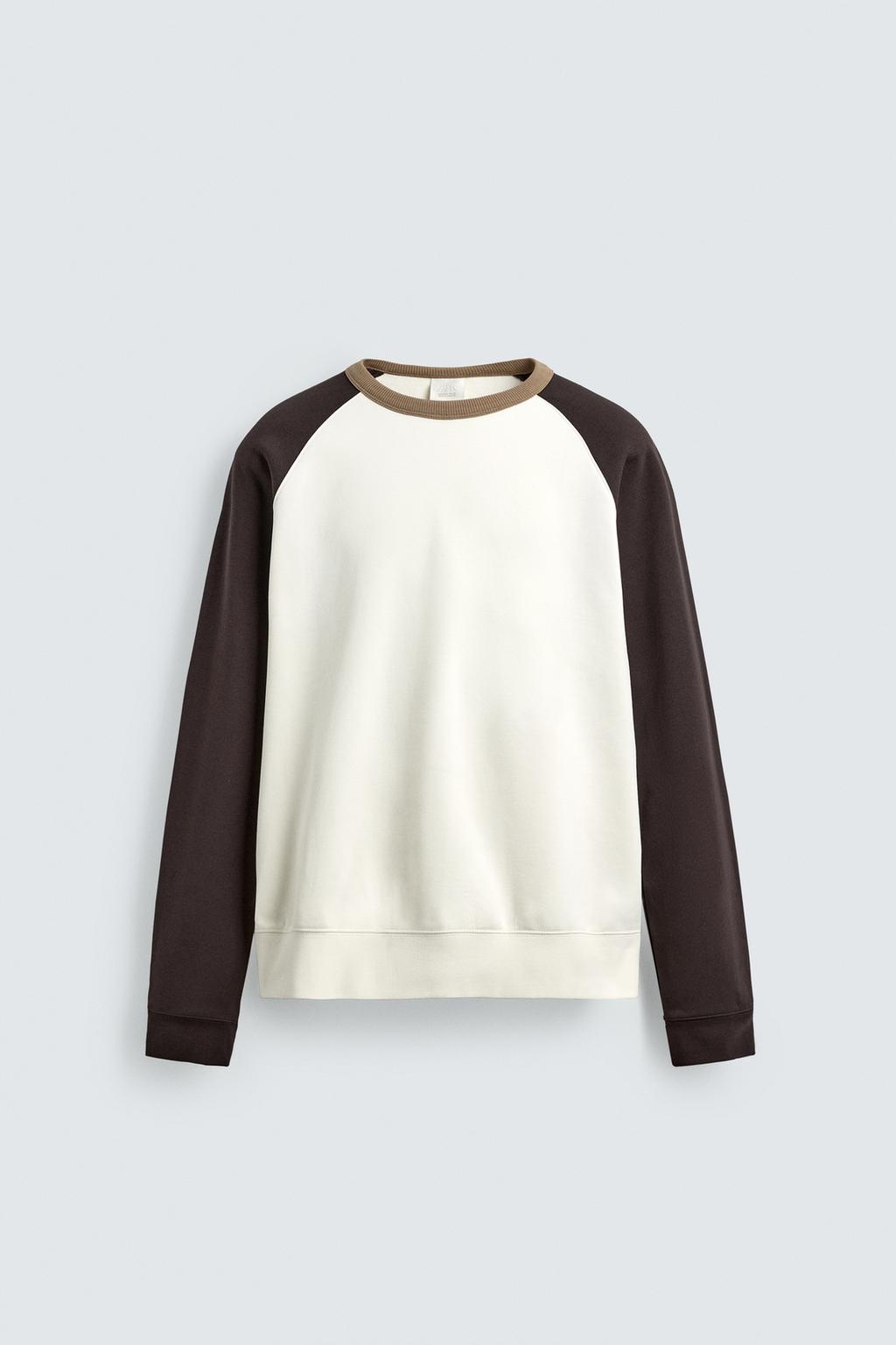 ТОЛСТОВКА С КОНТРАСТНЫМИ ВСТАВКАМИ И КРУГЛЫМ ВЫРЕЗОМ